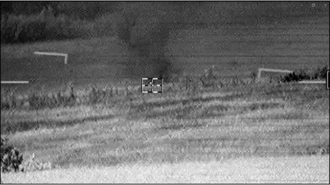 Screenshot from HUD (Head Up Display) footage inside a KA-52 helicopter provided by the RU MOD: “A Ka-52 helicopter crew destroyed an AFU armoured fighting vehicle with a direct guided missile hit.”
